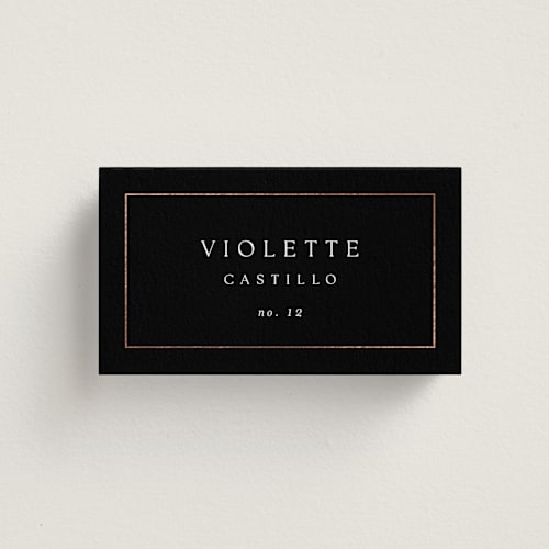 This is a onyx wedding place cards with foil pressed by Kelly Schmidt called framed monogram printing on signature in placecard