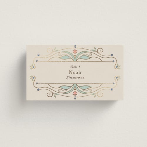 This is a ivory wedding place cards with foil pressed by Maria Hilas-Louie called ornate elegance printing on signature in placecard