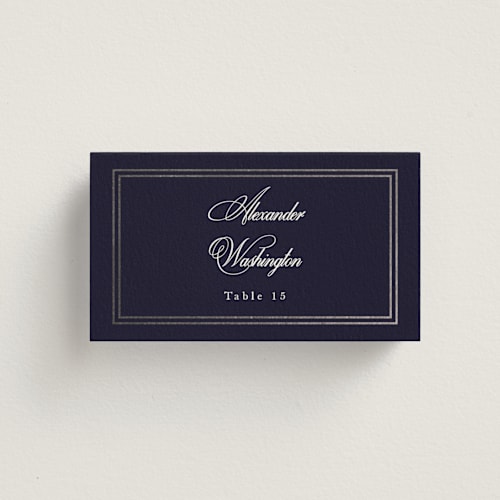 This is a navy wedding place cards with foil pressed by Sarah Brown called traditionalist printing on signature in placecard