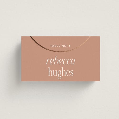This is a clay wedding place cards with foil pressed by Morgan Kendall called unity printing on signature in placecard