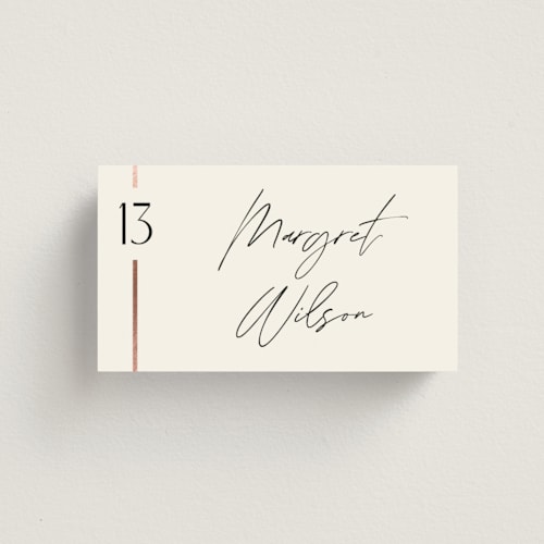 This is a cream puff wedding place cards with foil pressed by Pixel and Hank called together printing on signature in placecard