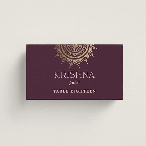 This is a plum wedding place cards with foil pressed by Randi Cirelli called arunima printing on signature in placecard