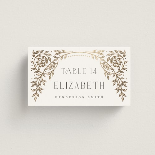This is a ivory wedding place cards with foil pressed by Ana de Sousa called gilded nouveau frame printing on signature in placecard