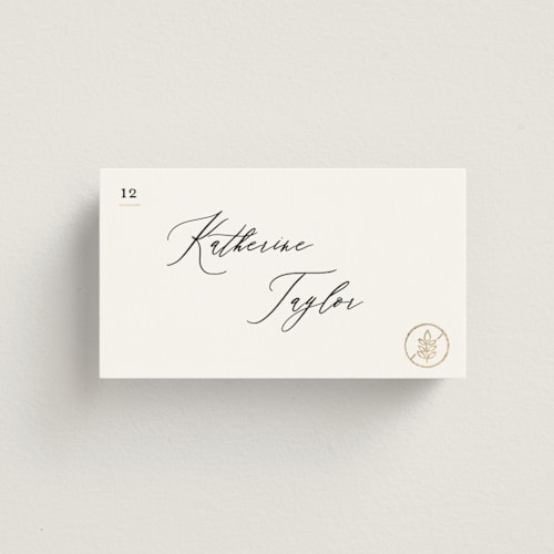 This is a ivory wedding place cards with foil pressed by Creo Study called gilded icons printing on signature in placecard