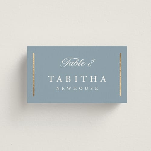 This is a dusty blue wedding place cards with foil pressed by Stacey Meacham called elegant bevel printing on signature in placecard