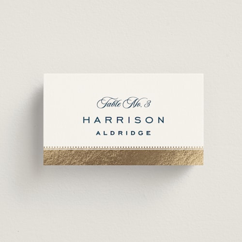 This is a royal navy wedding place cards with foil pressed by Olivia Raufman called anchored printing on signature in placecard