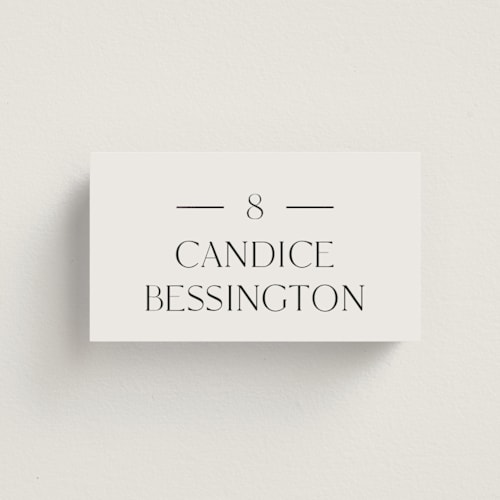 This is a linen wedding place cards with foil pressed by Baumbirdy called floral type arch printing on signature in placecard