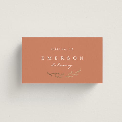 This is a terracotta wedding place cards with foil pressed by Brianne Larsen called branched printing on signature in placecard