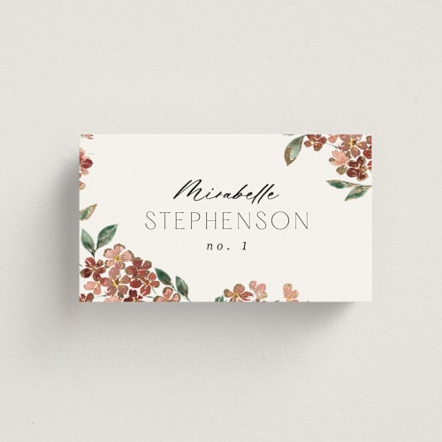 This is a dusty rose wedding place cards with foil pressed by Itsy Belle Studio called sweeping vine printing on signature in placecard