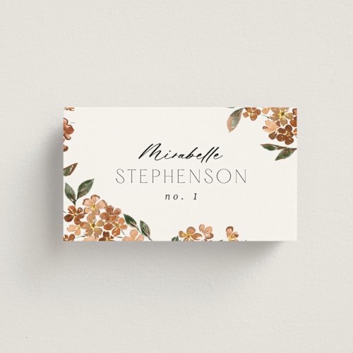 This is a terracotta wedding place cards with foil pressed by Itsy Belle Studio called sweeping vine printing on signature in placecard