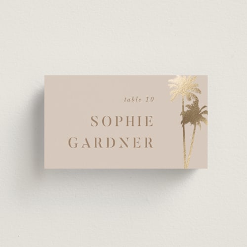 This is a tan wedding place cards with foil pressed by lulu and isabelle called sunset by the sea printing on signature in placecard