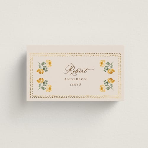 This is a golden wedding place cards with foil pressed by Claudia Orengo called tuileries printing on signature in placecard