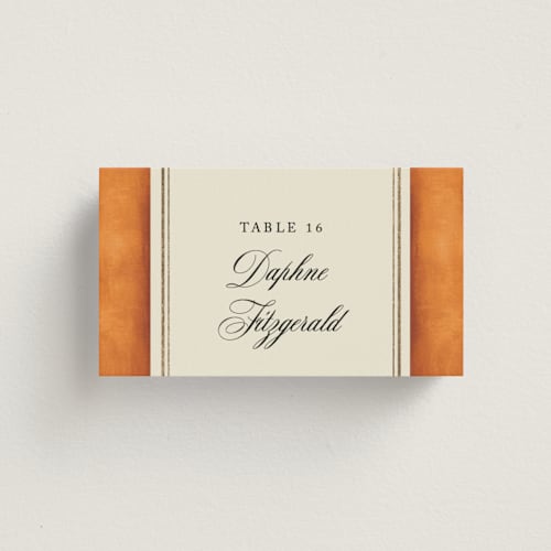 This is a tangerine wedding place cards with foil pressed by Jackie Crawford called josephine printing on signature in placecard