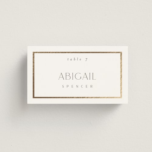 This is a porcelain wedding place cards with foil pressed by Nicole Walsh called regal printing on signature in placecard