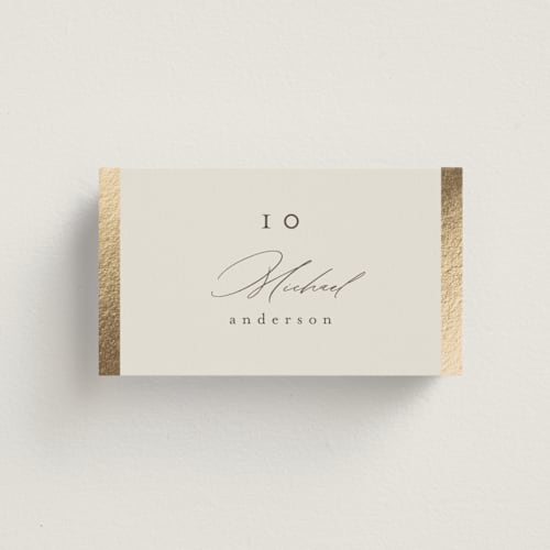 This is a sand wedding place cards with foil pressed by Nicole Walsh called surround printing on signature in placecard
