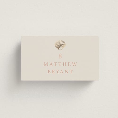 This is a coral wedding place cards with foil pressed by Hannah Bowman called simple seashell printing on signature in placecard