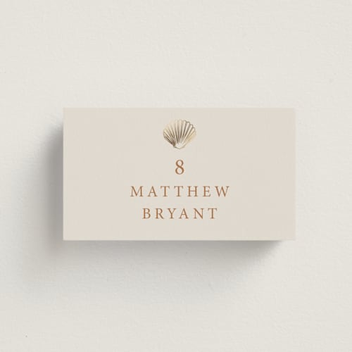 This is a sunset wedding place cards with foil pressed by Hannah Bowman called simple seashell printing on signature in placecard