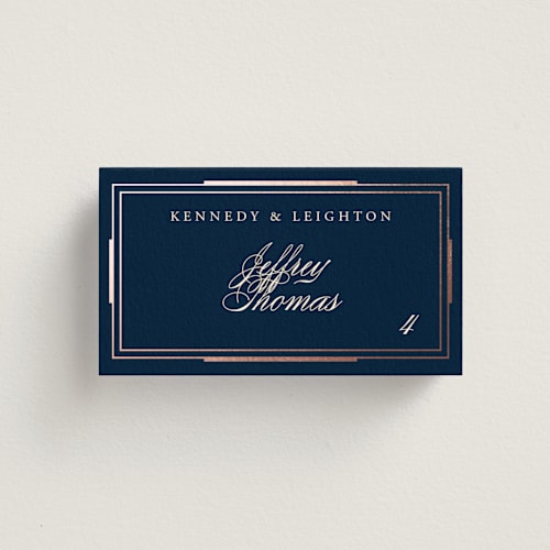 This is a navy wedding place cards with foil pressed by Hooray Creative called opulent border printing on signature in placecard