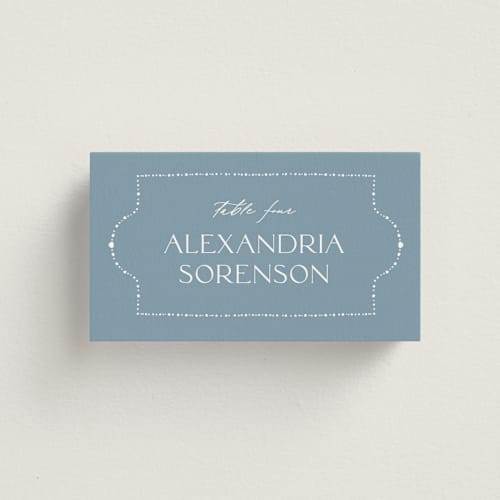 This is a delft blue wedding place cards with standard by Ashley DeMeyere called porcelain printing on signature in placecard