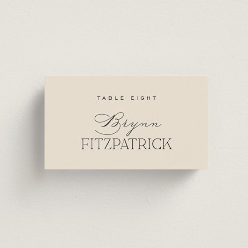 This is a creme wedding place cards with standard by Carly Reed Walker called tendu printing on signature in placecard