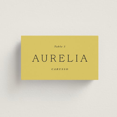 This is a citrine wedding place cards with standard by Olivia Kanaley Inman called antique ribbon printing on signature in placecard
