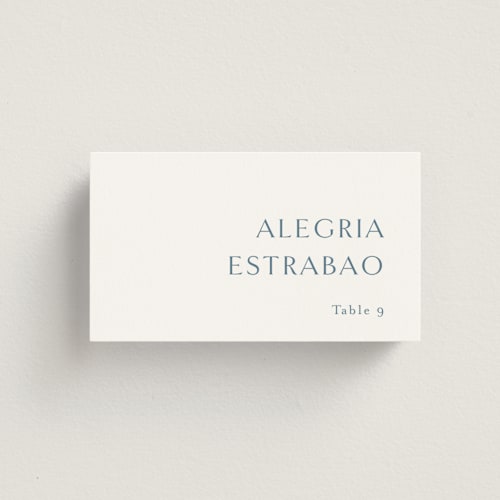 This is a dusty blue wedding place cards with standard by Jennifer Postorino called graceful printing on signature in placecard