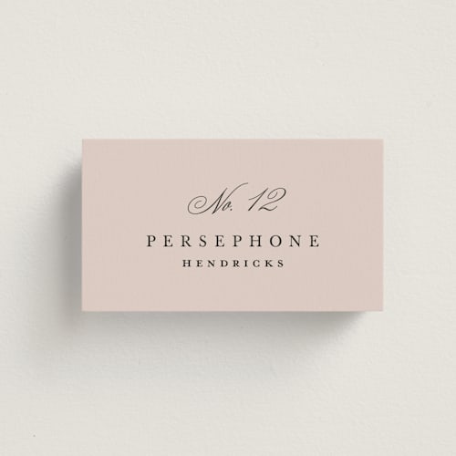 This is a dusty rose wedding place cards with standard by Kelly Schmidt called arch monogram printing on signature in placecard