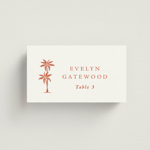 This is a persimmon wedding place cards with standard by Olivia Raufman called palm monogram printing on signature in placecard