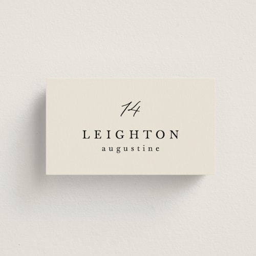 This is a ecru wedding place cards with standard by Hooray Creative called scripted names printing on signature in placecard