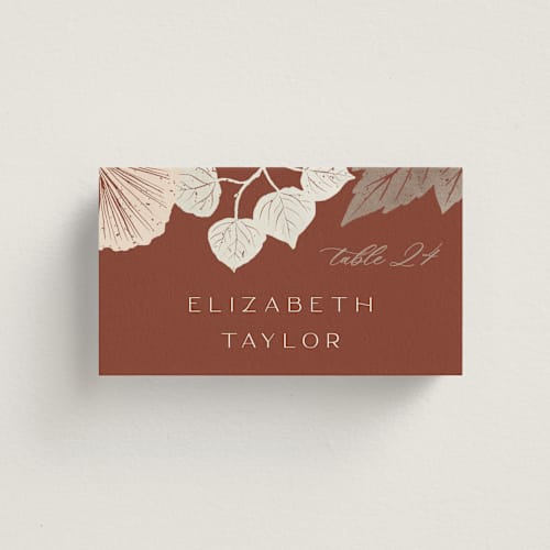 This is a latte wedding place cards with standard by Alethea and Ruth called leaf cascade printing on signature in placecard