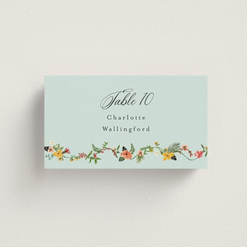 This is a papaya wedding place cards with standard by Susan Moyal called tropical crest printing on signature in placecard
