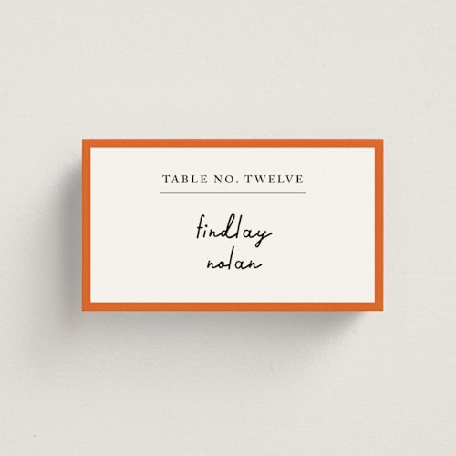 This is a peach wedding place cards with standard by mo kelley called swirl frame printing on signature in placecard