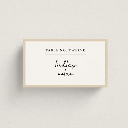 This is a champagne wedding place cards with standard by mo kelley called swirl frame printing on signature in placecard