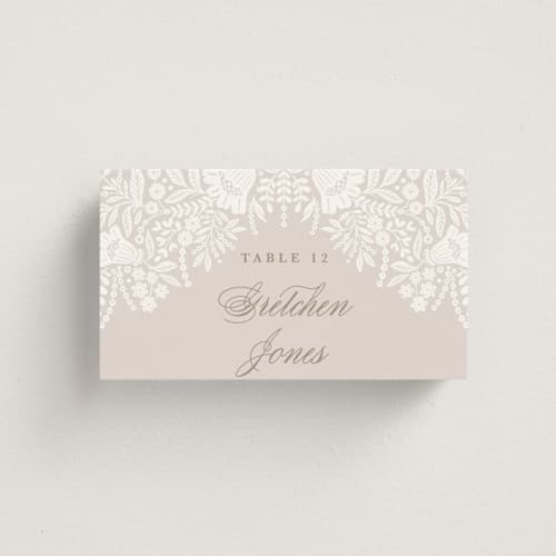 This is a cream wedding place cards with standard by Kristen Smith called lace trim printing on signature in placecard