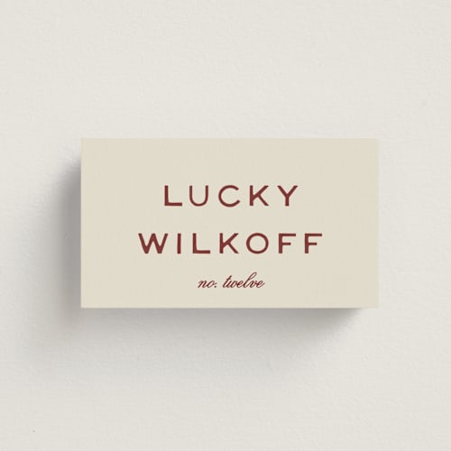 This is a rust wedding place cards with standard by Ani Somi called rose ink printing on signature in placecard