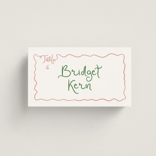 This is a carnation wedding place cards with standard by Creo Study called squiggly type printing on signature in placecard