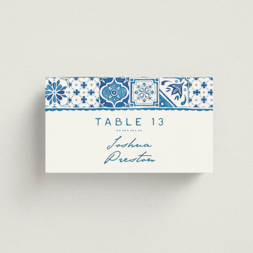 This is a navy wedding place cards with standard by Anastasia Makarova called watercolor tile printing on signature in placecard