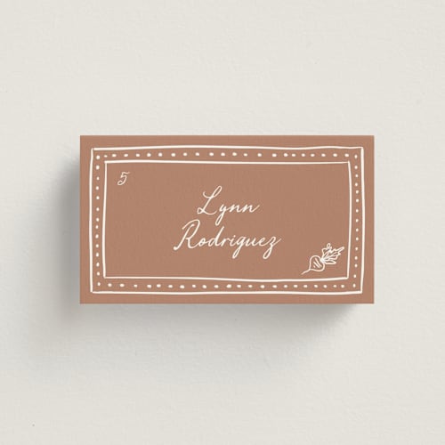 This is a terracotta wedding place cards with standard by Erin Deegan called sketched frame printing on signature in placecard