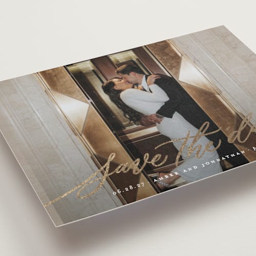 This is a chamomile foil stamped save the date cards with foil pressed by Wildfield Paper Co called daisy printing on recycled smooth signature in standard