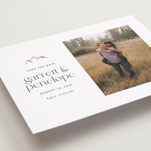 This is a snow foil stamped save the date cards with foil pressed by Amy Payne called minimal mountain printing on recycled smooth signature in standard