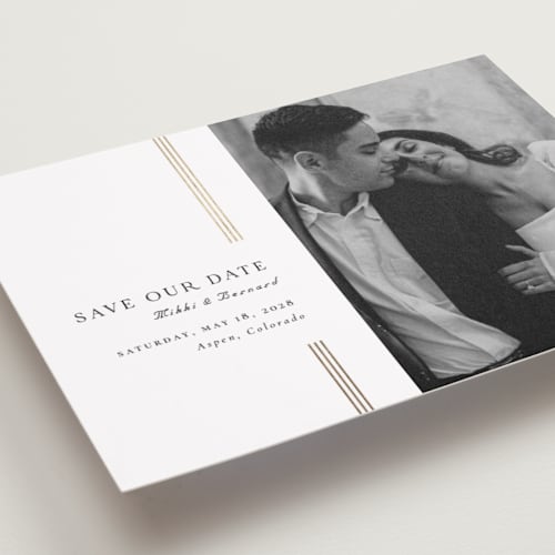 This is a lily foil stamped save the date cards with foil pressed by Orasie called bookmark a new page printing on recycled smooth signature in standard