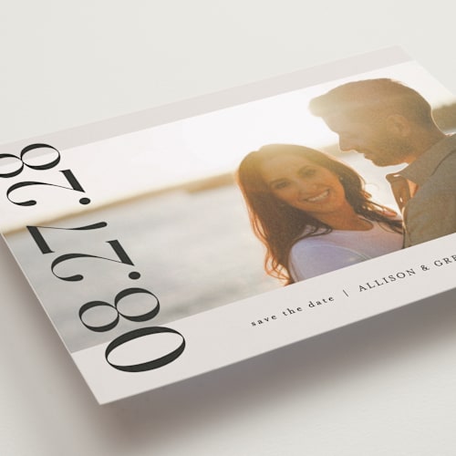 This is a ivory save the date with standard by Pixel and Hank called all stacked up printing on recycled smooth signature in standard
