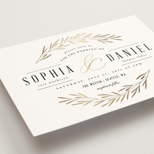 This is a classic white foil stamped wedding invitations with foil pressed by Kelly Schmidt called gilded leaves printing on signature in standard