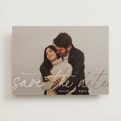 This is a snow foil stamped save the date cards with foil pressed by Sara Hicks Malone called scripted printing on recycled smooth signature in standard