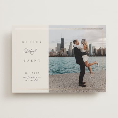 This is a ivory foil stamped save the date cards with foil pressed by Laura Hankins called aligned printing on recycled smooth signature in standard