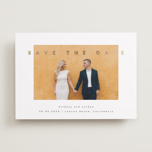 This is a porcelain foil stamped save the date cards with foil pressed by Stacy Maalouf called gilded simplicity printing on recycled smooth signature in standard