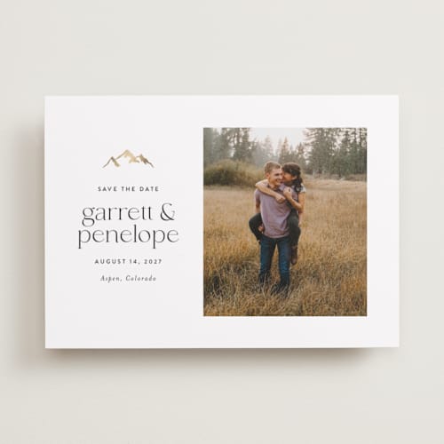 This is a snow foil stamped save the date cards with foil pressed by Amy Payne called minimal mountain printing on recycled smooth signature in standard