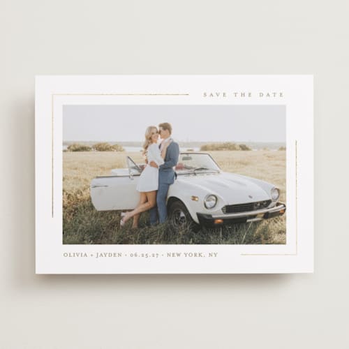 This is a lily foil stamped save the date cards with foil pressed by Christy Hy Lee called clean lines printing on recycled smooth signature in standard