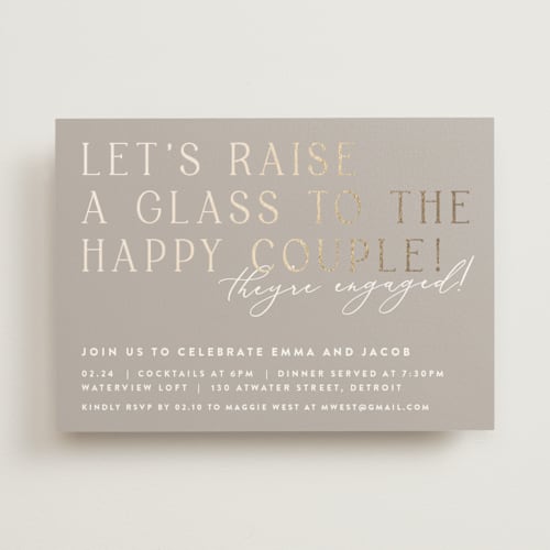 This is a buttercream engagement party invitations with foil pressed by Lisa Assenmacher called let's raise a glass printing on signature in standard