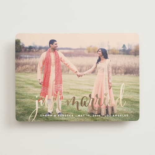 This is a gold wedding announcements with foil pressed by Annie Clark called aglow printing on recycled smooth signature in standard